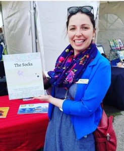 Jessica Baird with the book titled The Socks